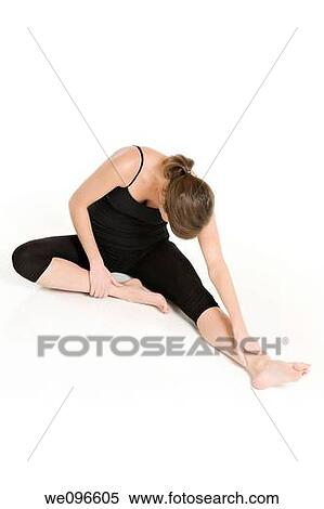 Stock Photography - Beautiful Caucasian woman practicing Yoda on a white background. Fotosearch