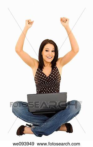 Beautiful caucasian woman sitting on a white background working on laptop computer View Large Photo Image Stock Photo - Beautiful caucasian woman sitting on a white background working on laptop computer. Fotosearch