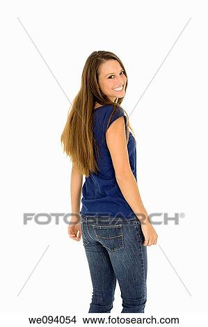 Beautiful caucasian woman standing on a white background wearing casaul clothing and smiling View Large Photo Image Picture - Beautiful caucasian woman standing on a white background wearing casaul clothing and smiling. Fotosearch
