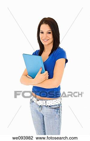 Beautiful caucasian woman standing on a white background wearing casaul clothing and smiling and holding a book View Large Photo Image Stock Image - Beautiful caucasian woman standing on a white background wearing casaul clothing and smiling and holding a book. Fotosearch