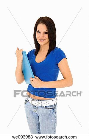 Beautiful caucasian woman standing on a white background wearing casaul clothing and smiling and holding a book View Large Photo Image Stock Image - Beautiful caucasian woman standing on a white background wearing casaul clothing and smiling and holding a book. Fotosearch