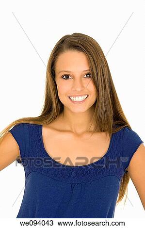 Stock Image - Beautiful caucasian woman standing on a white background wearing casaul clothing and smiling. Fotosearch