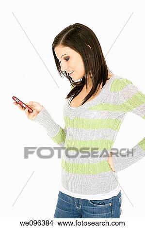 Beautiful Caucasian woman text messaging on white background View Large Photo Image Picture - Beautiful Caucasian woman text messaging on white background. Fotosearch