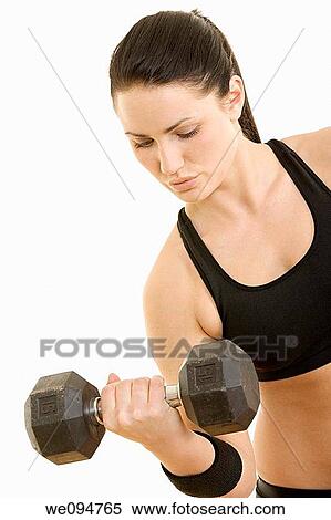 Beautiful Caucasian woman using dumbbells on white background View Large Photo Image Stock Photography - Beautiful Caucasian woman using dumbbells on white background. Fotosearch