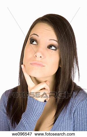 Beautiful Caucasian woman wondering or thinking on a white background View Large Photo Image Stock Photo - Beautiful Caucasian woman wondering or thinking on a white background. Fotosearch