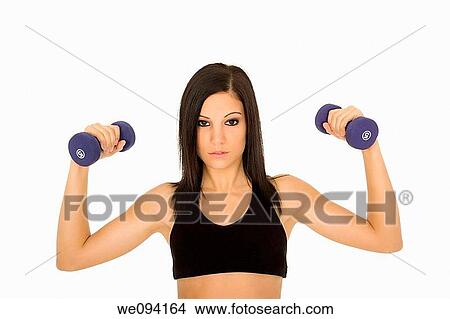 Beautiful Caucasian woman working out with dumbbells on white background View Large Photo Image Picture - Beautiful Caucasian woman working out with dumbbells on white background. Fotosearch