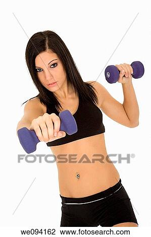 Beautiful Caucasian woman working out with dumbbells on white background View Large Photo Image Stock Image - Beautiful Caucasian woman working out with dumbbells on white background. Fotosearch