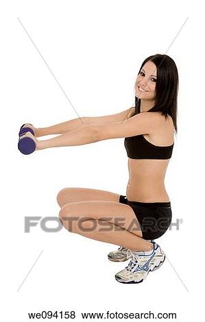 Beautiful Caucasian woman working out with dumbbells on white background View Large Photo Image Stock Photo - Beautiful Caucasian woman working out with dumbbells on white background. Fotosearch