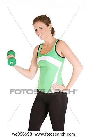 Beautiful Caucasian woman working out with dumbbells View Large Photo Image Stock Photo - Beautiful Caucasian woman working out with dumbbells. Fotosearch