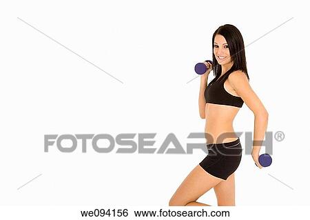 Beautiful Caucasian woman working out with dumbbells on white background View Large Photo Image Stock Photograph - Beautiful Caucasian woman working out with dumbbells on white background. Fotosearch
