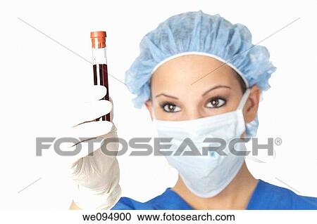 Beautiful laboratory technician examining a tube of blood View Large Photo Image Stock Image - Beautiful laboratory technician examining a tube of blood. Fotosearch