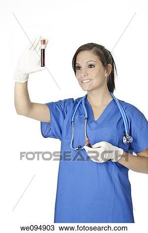 Beautiful laboratory technician examining a tube of blood View Large Photo Image Stock Image - Beautiful laboratory technician examining a tube of blood. Fotosearch