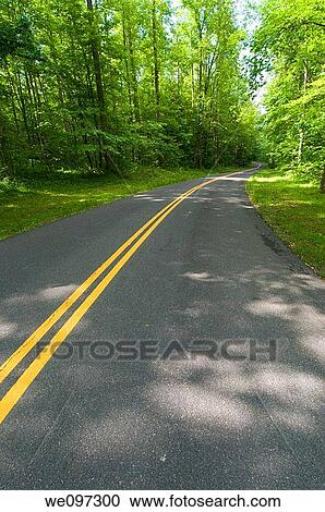 Beautiful scenic country road curves through Great Smoky Mountain National Park View Large Photo Image Stock Image - Beautiful scenic country road curves through Great Smoky Mountain National Park. Fotosearch