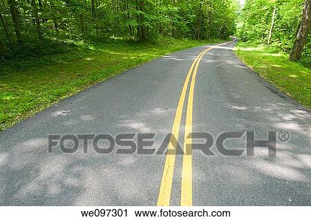 Beautiful scenic country road curves through Great Smoky Mountain National Park View Large Photo Image Stock Image - Beautiful scenic country road curves through Great Smoky Mountain National Park. Fotosearch
