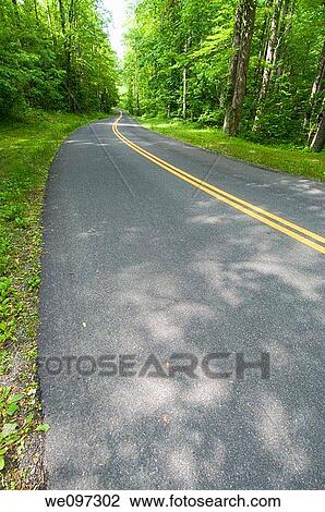 Beautiful scenic country road curves through Great Smoky Mountain National Park View Large Photo Image Stock Image - Beautiful scenic country road curves through Great Smoky Mountain National Park. Fotosearch
