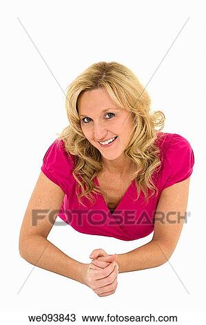 Beautiful woman laying on a white background together in casual clothing View Large Photo Image Stock Image - Beautiful woman laying on a white background together in casual clothing. Fotosearch