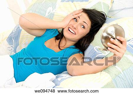 Beautiful woman oversleeping in the morning View Large Photo Image Stock Photo - Beautiful woman oversleeping in the morning. Fotosearch