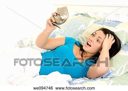 Beautiful woman oversleeping in the morning View Large Photo Image Stock Photograph - Beautiful woman oversleeping in the morning. Fotosearch