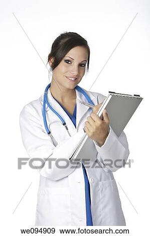 Beautiful young doctor writing on the pad over white background View Large Photo Image Stock Photo - Beautiful young doctor writing on the pad over white background. Fotosearch