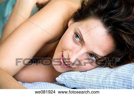 bed, blue eyes, brown hair, chestnut hair View Large Photo Image Picture - bed, blue eyes, brown hair, chestnut hair. Fotosearch