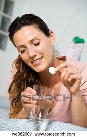 Stock Photo - bed, chestnut hair, brown hair, at-home. Fotosearch