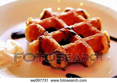 Belgian waffles with cream and syrup, Gaufres, Belgium, Europe View Large Photo Image Stock Image - Belgian waffles with cream and syrup, Gaufres, Belgium, Europe. Fotosearch