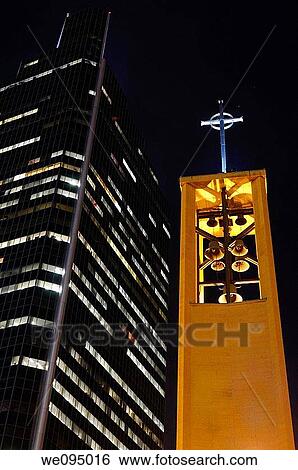 Bell Tower of Saint Olaf Catholic church with Campbell Mithum highrise tower in Minneapolis at night View Large Photo Image Stock Photograph - Bell Tower of Saint Olaf Catholic church with Campbell Mithum highrise tower in Minneapolis at night. Fotosearch