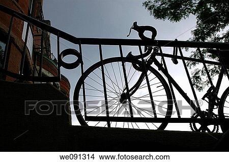 Picture - Bicycle Silhouetted Against a Cloudy Sky. Fotosearch
