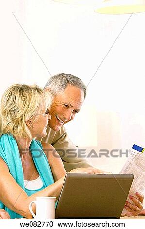 Stock Image - bill, computer, at-home. Fotosearch