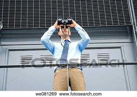 Stock Photo - binocular, business, businessman, businesspeople. Fotosearch