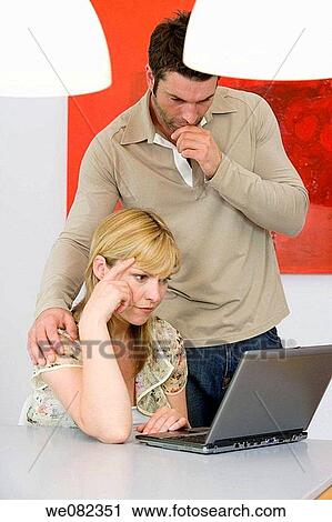Stock Image - black hair, blond, at-home. Fotosearch