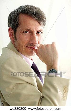 Stock Image - black hair, blue eyes, business, businessman, businesspeople. Fotosearch