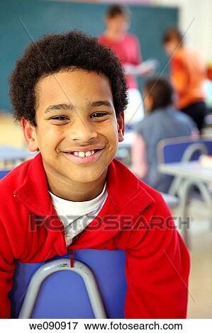 Stock Photo - black hair, boy, child, classroom, contemporary. Fotosearch