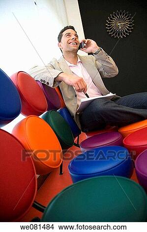 black hair, business, cell phone, chair View Large Photo Image Picture - black hair, business, cell phone, chair. Fotosearch
