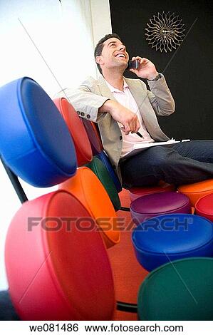 black hair, business, cell phone, chair View Large Photo Image Stock Photograph - black hair, business, cell phone, chair. Fotosearch