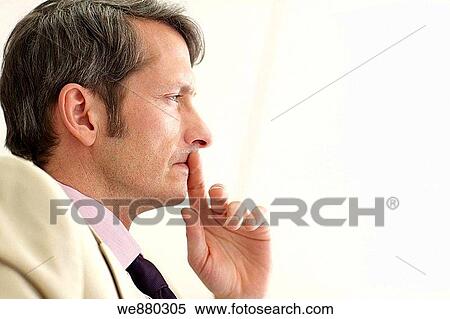 Stock Photography - black hair, businessman, business, blue eyes, absorbed. Fotosearch