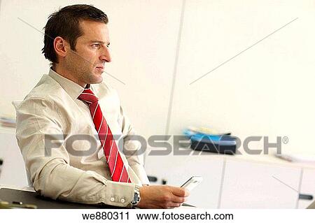Stock Image - black hair, businesspeople, businessman, business, absorbed. Fotosearch
