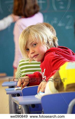 Stock Photo - blackboard, blond, blue eyes, board, boy. Fotosearch
