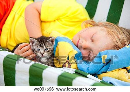 blond boy playing with kitten View Large Photo Image Stock Photograph - blond boy playing with kitten. Fotosearch