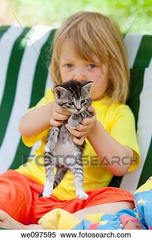 blond boy playing with kitten View Large Photo Image Stock Photography - blond boy playing with kitten. Fotosearch