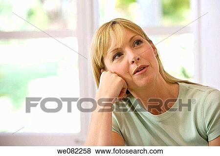 Stock Photo - blond, calm, absorbed. Fotosearch