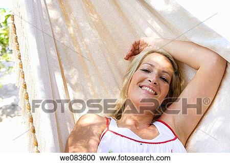 blond, chilling out, calm, Arms raised View Large Photo Image Stock Image - blond, chilling out, calm, Arms raised. Fotosearch