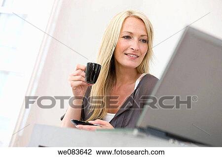 Stock Image - blond, coffee, at-home. Fotosearch