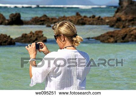 Blond tourist in the Atlantic ocean Lanzarote island Canary islands Spain View Large Photo Image Stock Image - Blond tourist in the Atlantic ocean Lanzarote island Canary islands Spain. Fotosearch