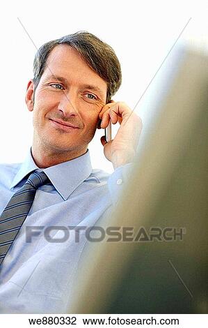 Stock Image - blue eyes, business, businessman, businesspeople, calling. Fotosearch