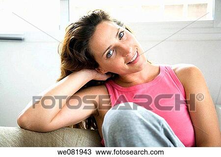 Stock Image - blue eyes, chestnut hair, brown hair, at-home. Fotosearch