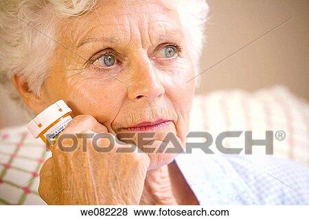Stock Photo - blue eyes, Close-up, absorbed. Fotosearch