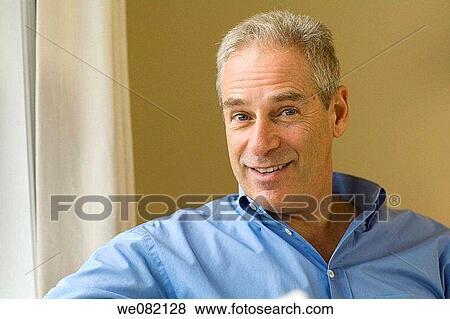 Stock Photo - blue eyes, contemporary, at-home. Fotosearch