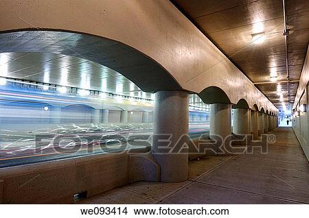 Blurred blue buses driving on the new Simcoe street underpass in Toronto View Large Photo Image Picture - Blurred blue buses driving on the new Simcoe street underpass in Toronto. Fotosearch
