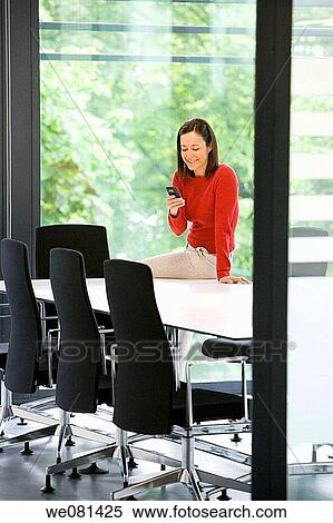 Stock Photography - board-room, brunette, business. Fotosearch